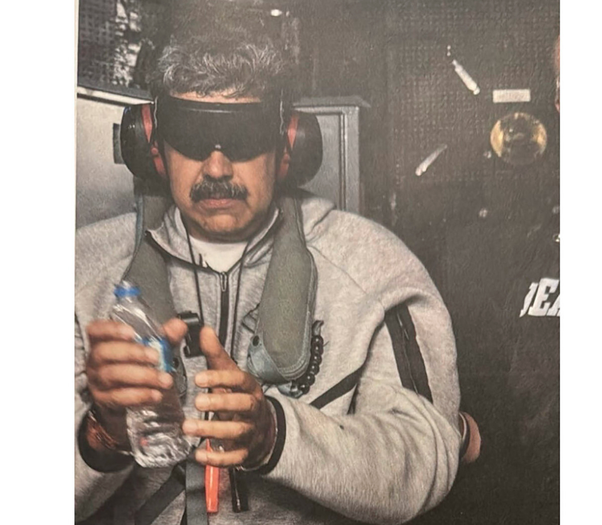 The photo of Maduro in handcuffs that Trump published
