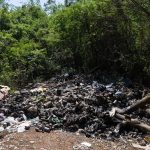 Garbage and pollution in lots and Autovía del Este in Guayacanes