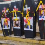 March with symbolic coffins marks strike along the New Central Highway in Huancayo