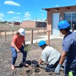 Mevir Campana plants trees prior to the inauguration of the complex