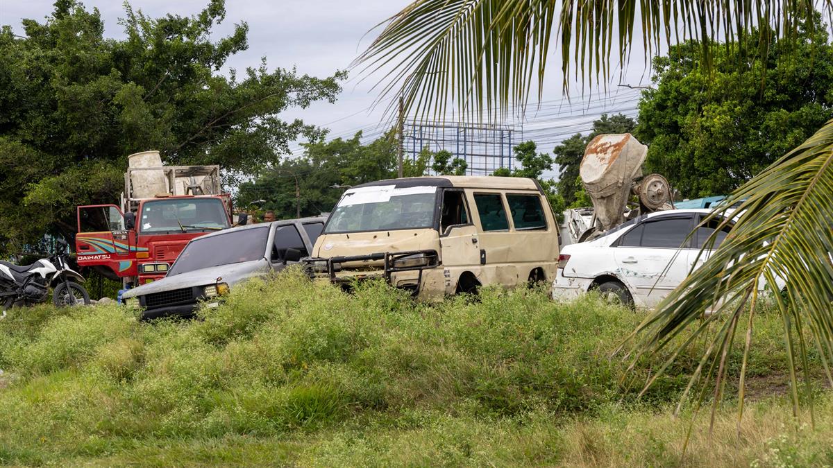 Scrap metal occupies a green area at the head of the 17th bridge