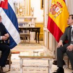 The Cuban Foreign Minister and Mike Hammer meet in Madrid, each on their own side