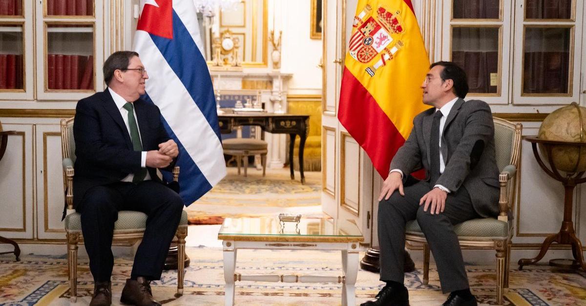 The Cuban Foreign Minister and Mike Hammer meet in Madrid, each on their own side