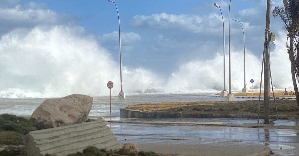 The sea invades the deserted streets of Havana