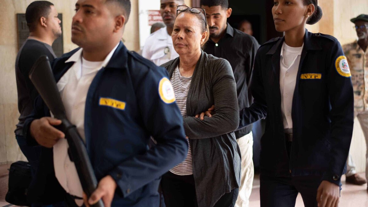 Court discharges woman accused of paying to have her husband killed